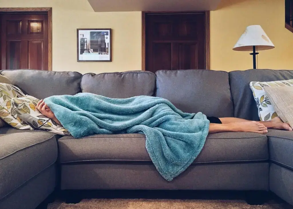 Is Zinc the Missing Link to Your Digestive Health and Sleep Quality? Sleeping on Sofa